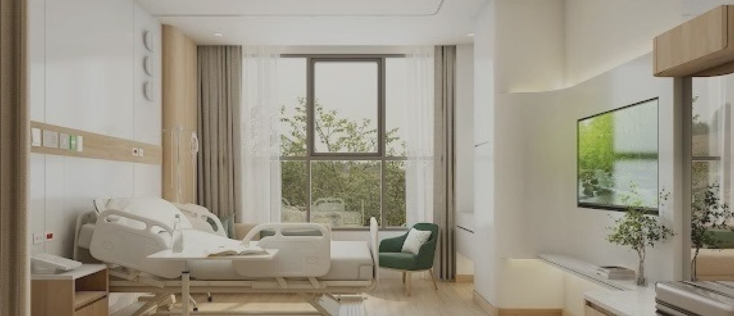 Patient room interior with natural light and garden view
