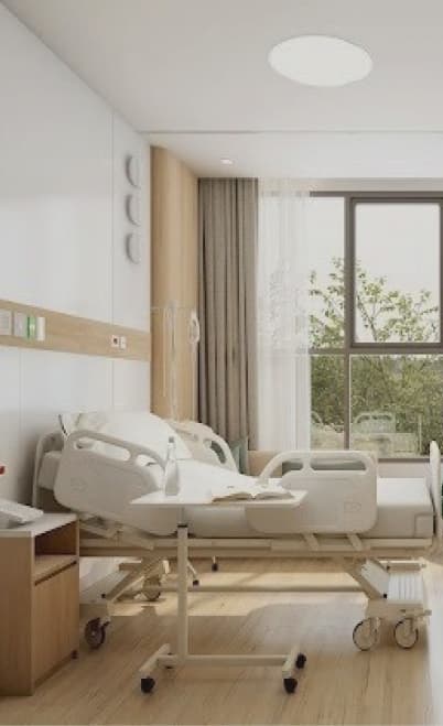 Patient room interior with natural light and garden view